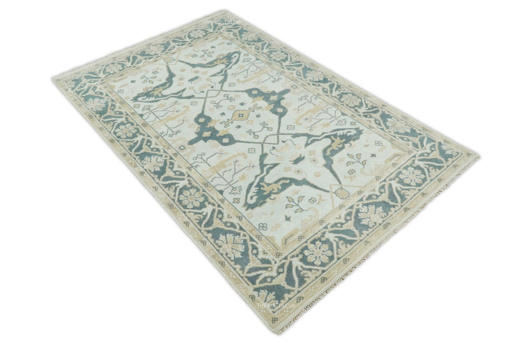 Hand knotted Oushak wool rug with teal and ivory diamond medallion design