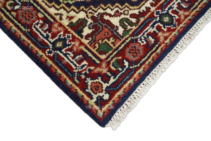 Runner rug corner showing its patterned wool pile and cream fringe
