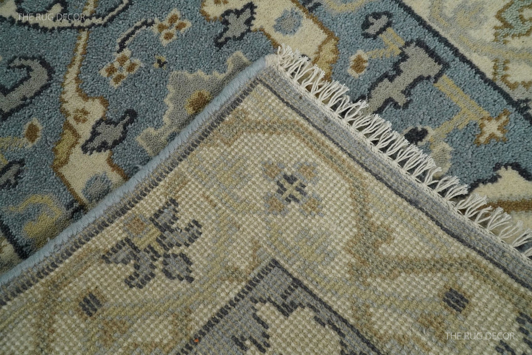 Hand-knotted rug underside with woven backing, bound edge, and fringe