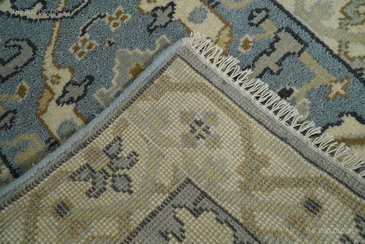 Hand-knotted rug underside with woven backing, bound edge, and fringe