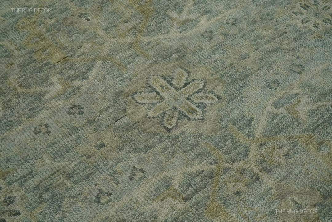 Close-up of the rug's wool weave and ivory floral motif