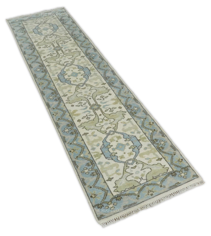 Angled view of the long Oushak runner rug with floral motifs and fringed ends
