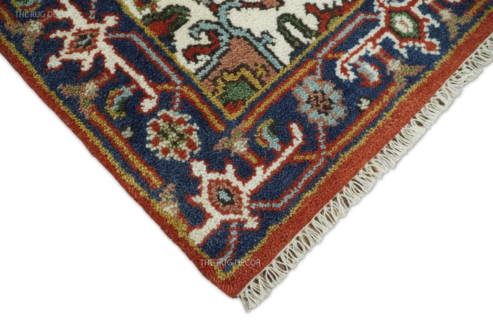 Corner detail of the patterned runner rug showing rust edging and fringe