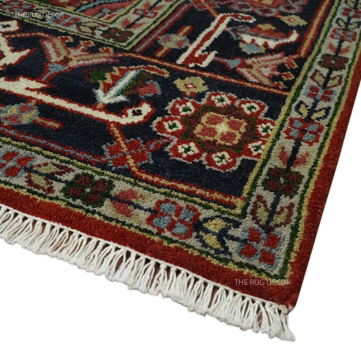 Serapi rug corner detail with floral border and cream fringe