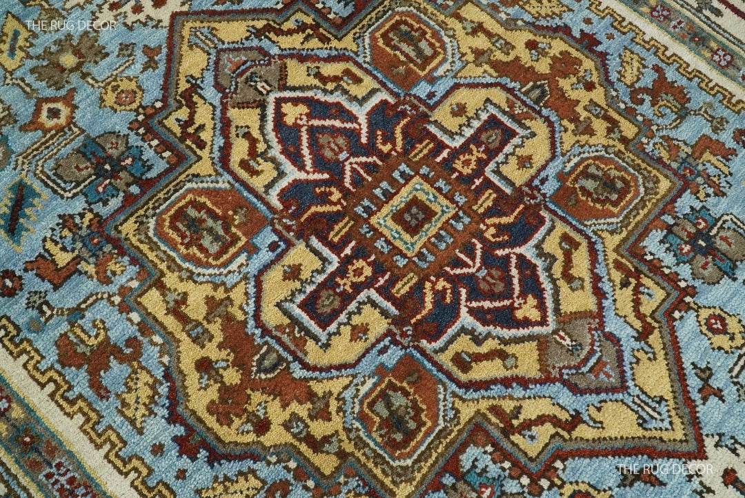 Sera rug close-up of its intricate central medallion in blue, ivory, and rust