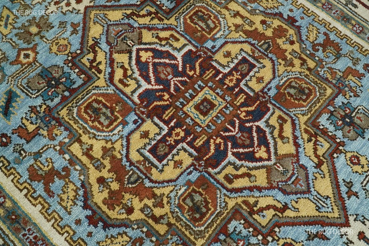 Sera rug close-up of its intricate central medallion in blue, ivory, and rust