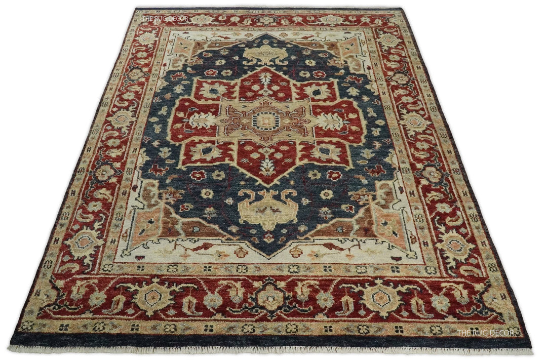 Full view of a red and blue Serapi wool rug with a central medallion and fringed edge
