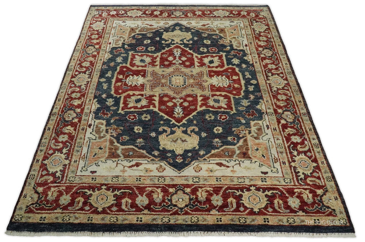 Full view of a red and blue Serapi wool rug with a central medallion and fringed edge