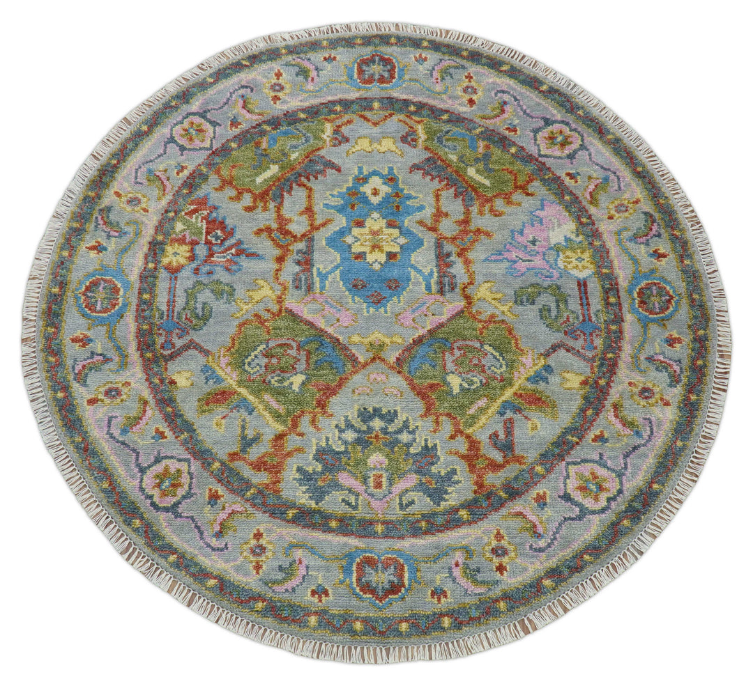 Round multicolor wool rug with symmetrical floral geometry and central medallion