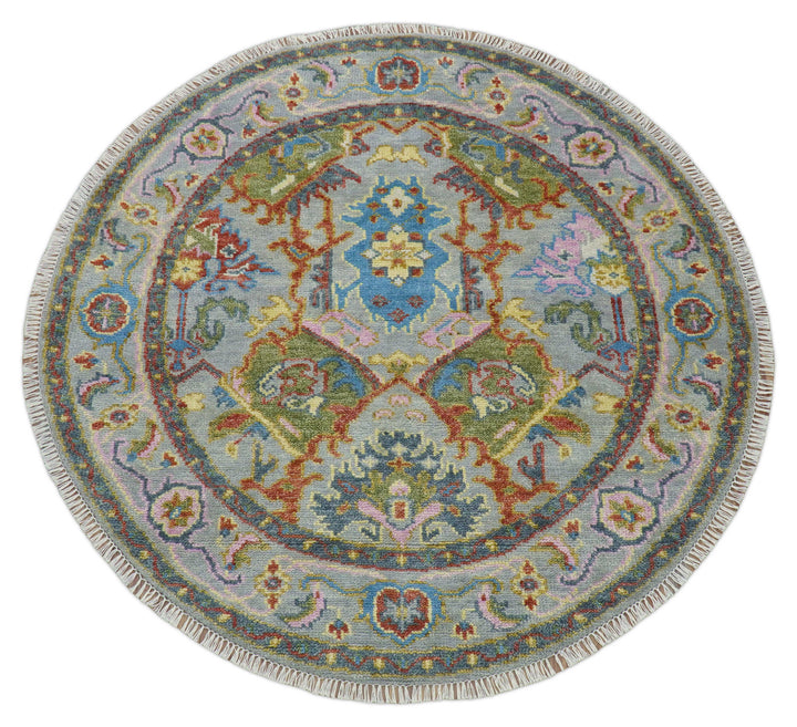 Round multicolor wool rug with symmetrical floral geometry and central medallion