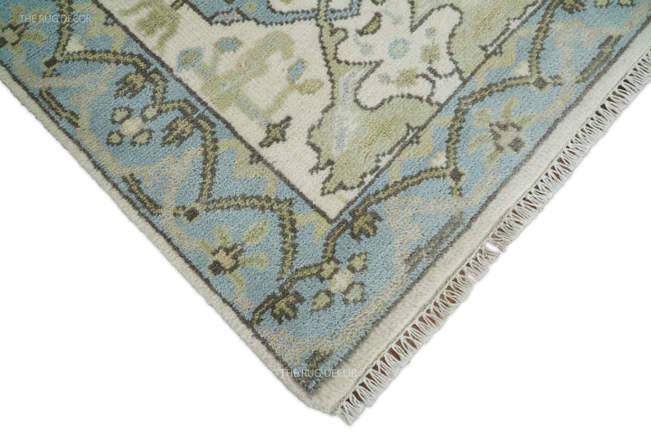 Runner rug corner showing its blue floral border and short ivory fringe