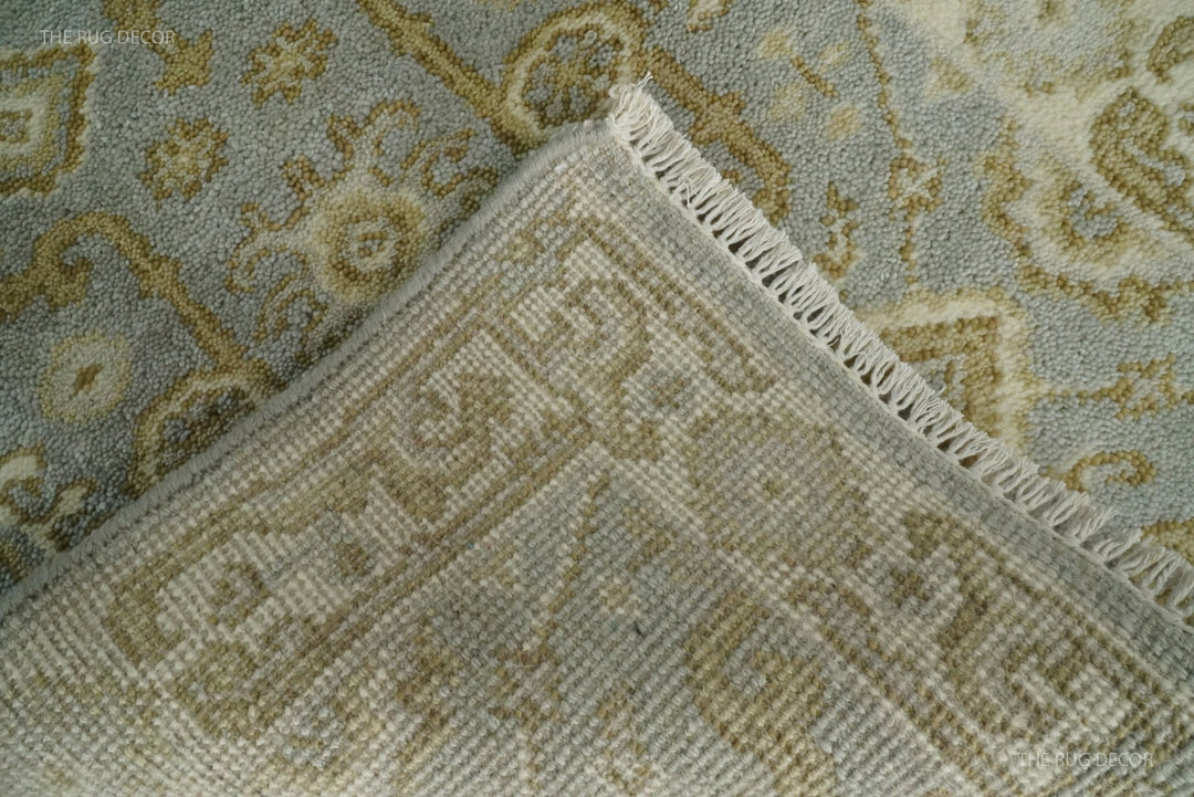 Folded corner reveals the rug's woven backing and tasseled edge