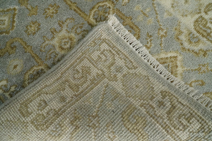 Folded corner reveals the rug's woven backing and tasseled edge