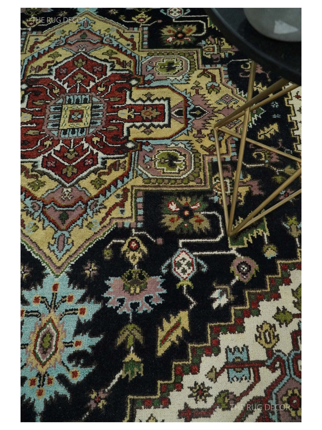Hand-knotted wool rug close-up of multicolor geometric motifs on a dark background