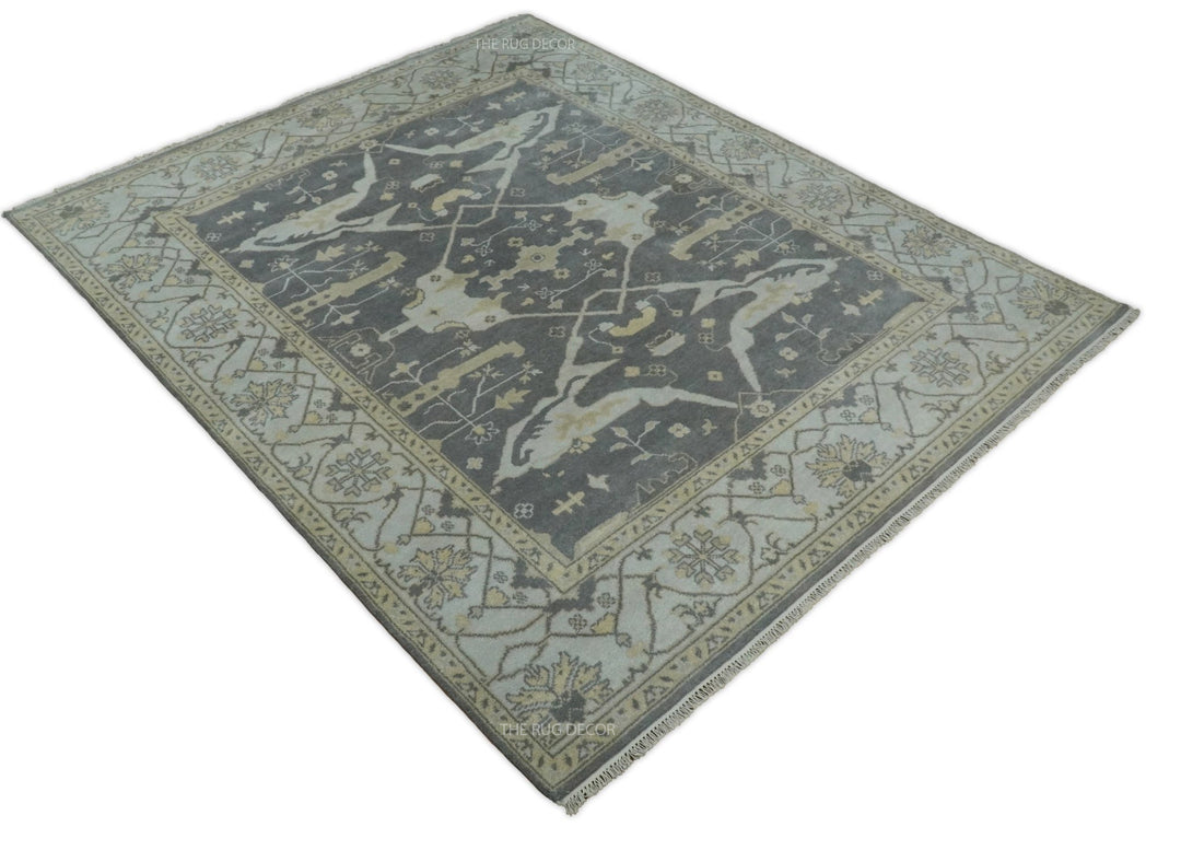 Vintage Oushak-style wool area rug, gray and ivory pattern viewed at an angle