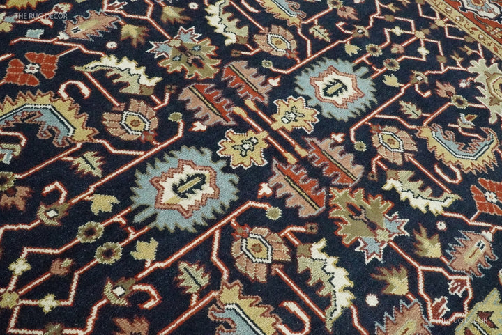 Close-up of the rug's intricate floral and geometric wool pattern