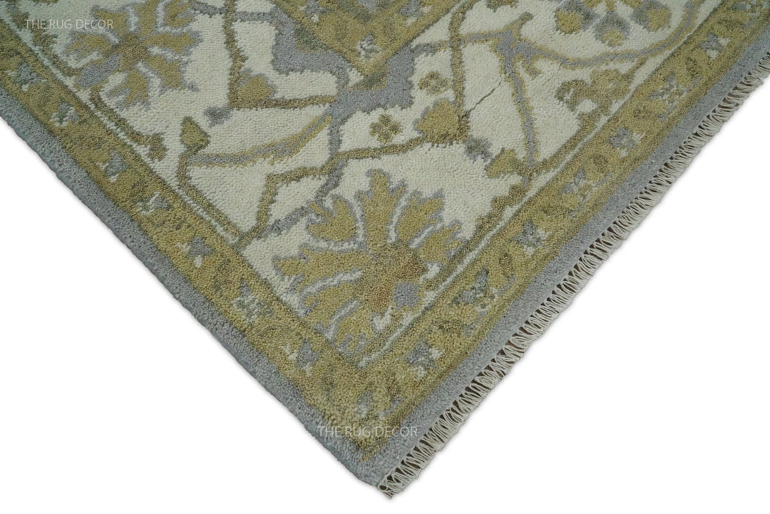 Oushak rug corner showing floral border, gray edging, and fringe
