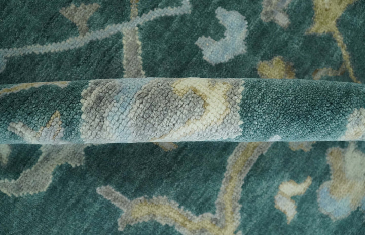Teal and beige Oushak rug side texture detail with low pile and woven border edge.