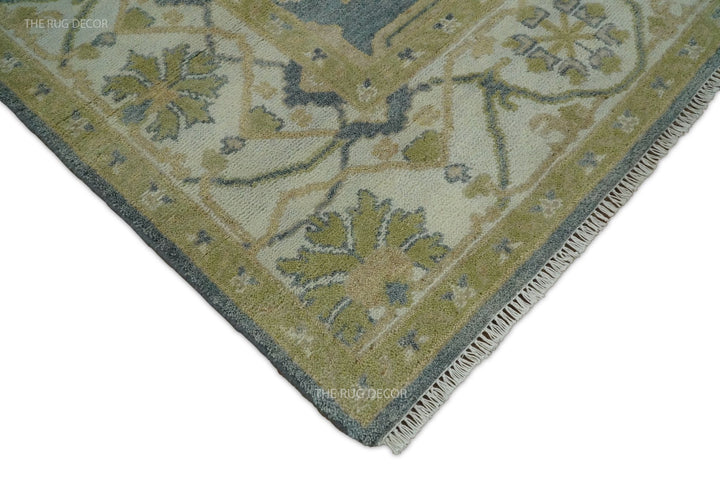 Rug corner showing its patterned border, bound edge, and short fringe