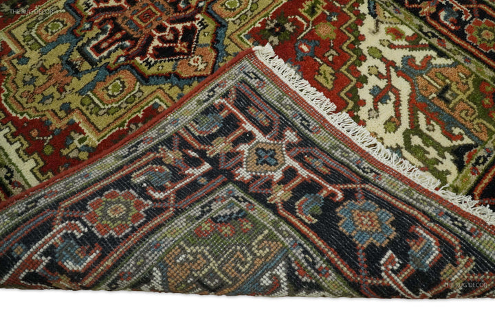 Woven pattern close-up of Serapi rug with navy, teal, rust and cream geometric bands