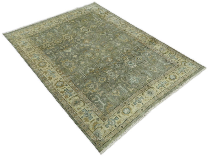 Vintage-style Turkish rug with gray-green field, beige border, and detailed geometric motifs