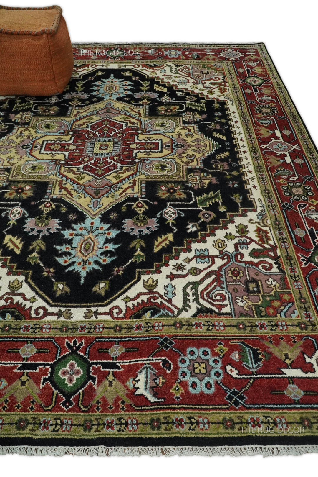Hand-knotted wool rug with large central medallion in black, red, and cream tones