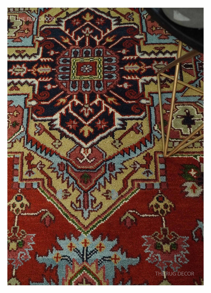 Serapi rug detail showing a dark geometric medallion on a red field