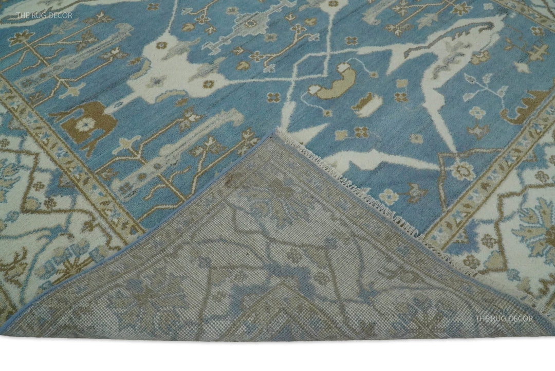Wool rug corner flipped back to show the woven underside and blue floral pattern