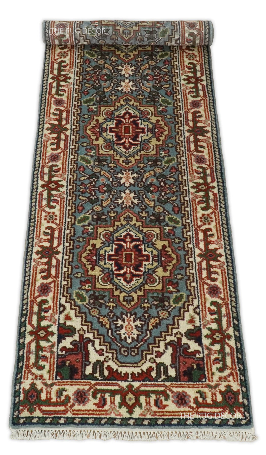 Traditional wool runner rug with blue center, ivory borders, and fringe