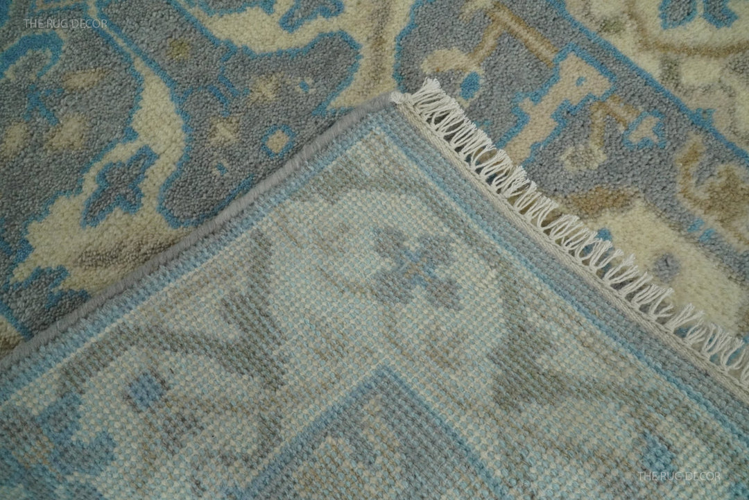 Runner rug corner flipped back to show the woven underside and fringe