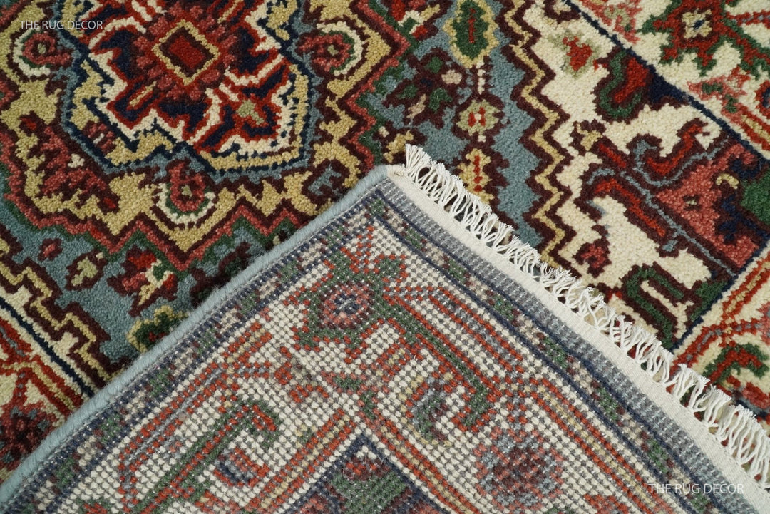Wool runner rug detail showing its woven back, bound edge, and ivory fringe
