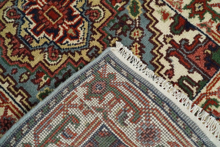 Wool runner rug detail showing its woven back, bound edge, and ivory fringe