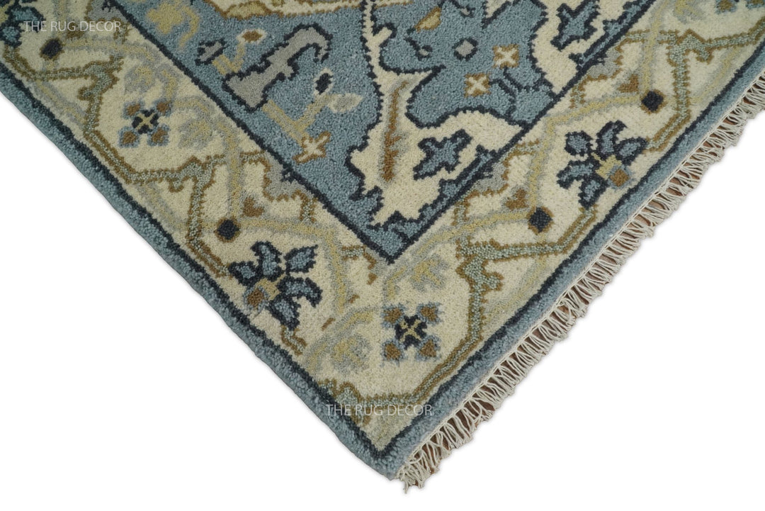 Runner rug corner detail with beige floral border and cream fringe