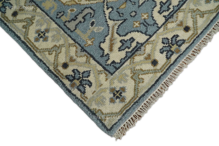 Runner rug corner detail with beige floral border and cream fringe