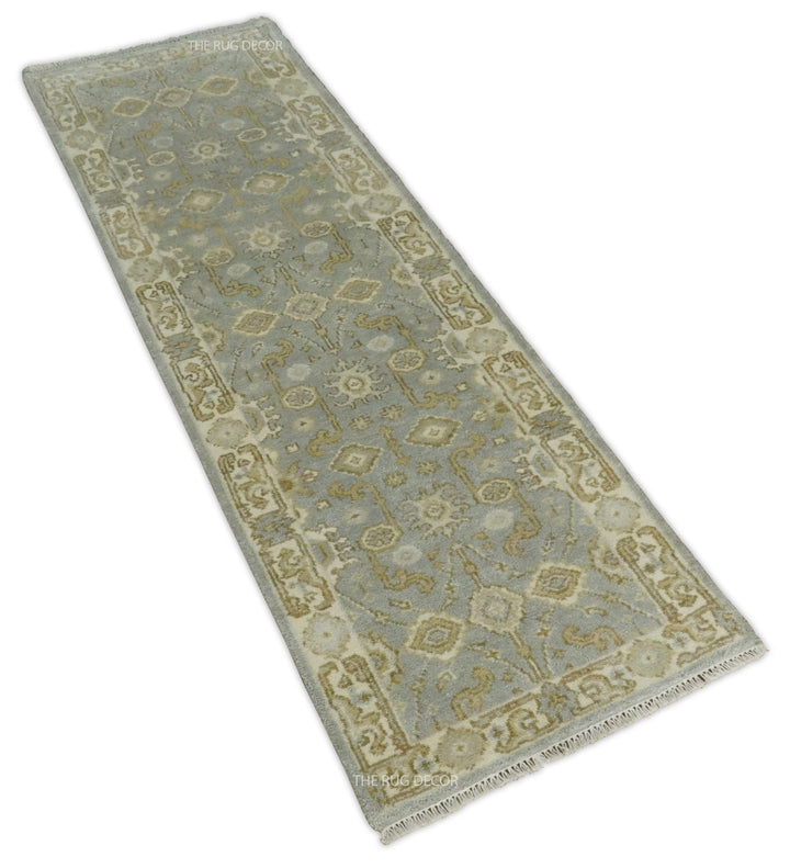 Angled view of the runner rug's floral medallions, border, and fringed edge