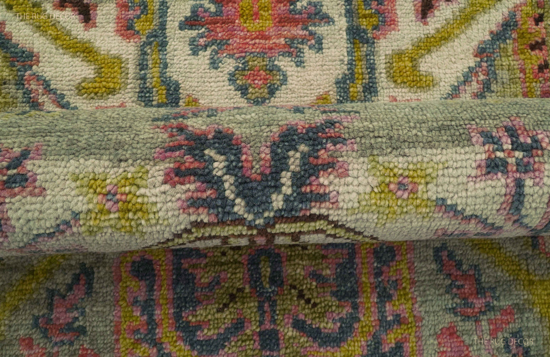 Folded runner rug showing its thick pile and detailed floral pattern