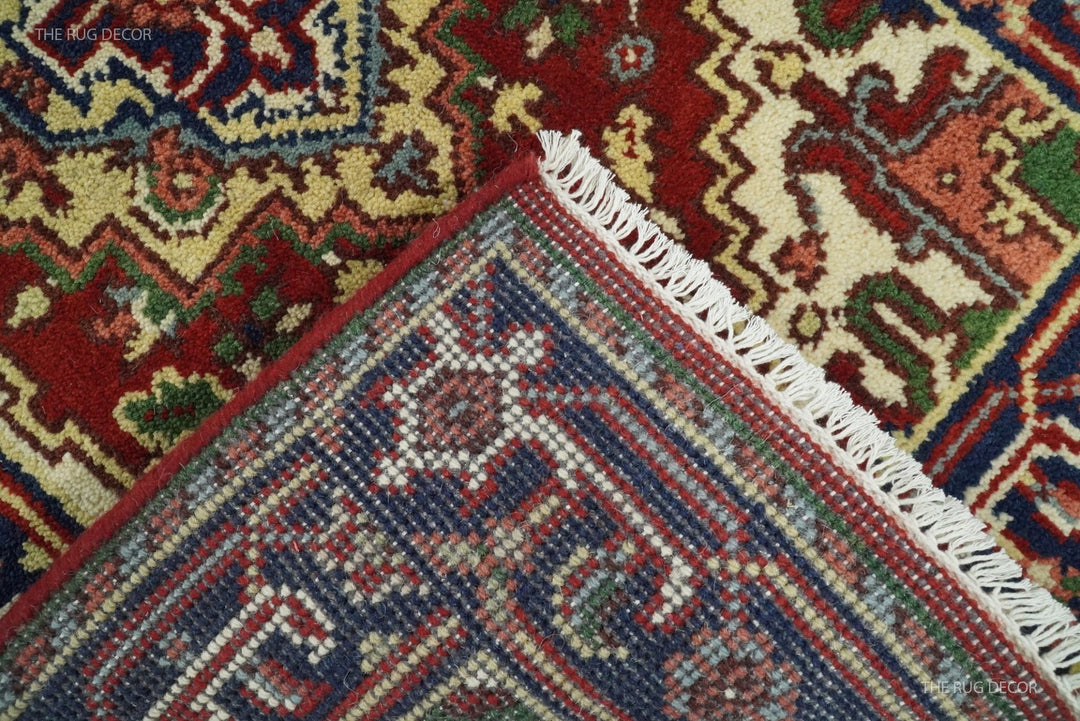 Underside detail of the rug corner with woven backing and cream fringe