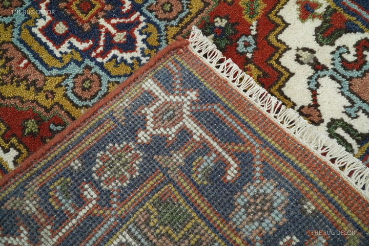Close-up of the rug's woven underside and fringed edge