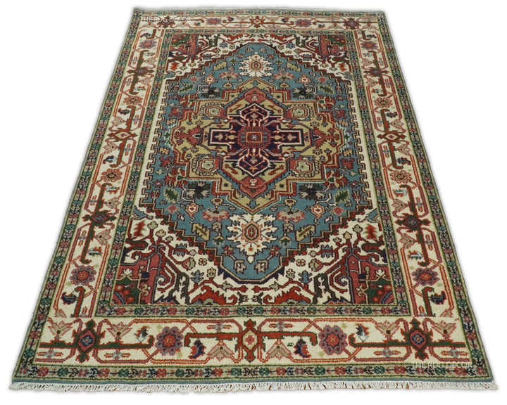 Full view of a rectangular medallion rug with blue, ivory, and rust motifs
