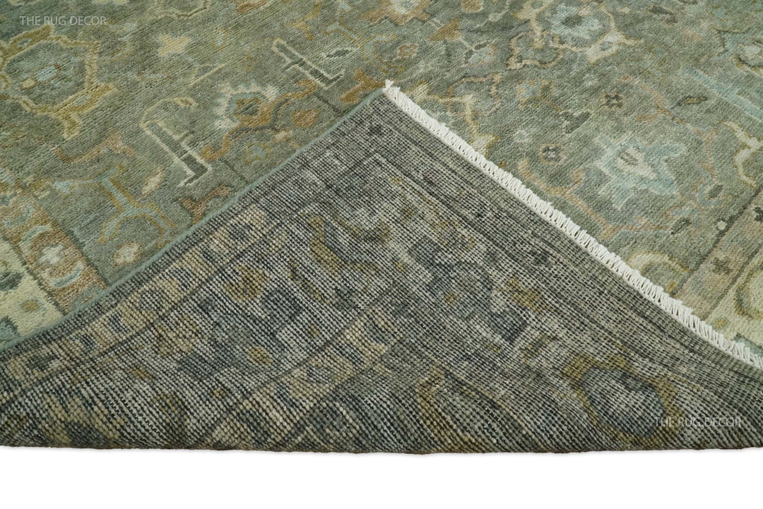 Rug corner with woven trim and dense pattern in gray-green with muted beige accents