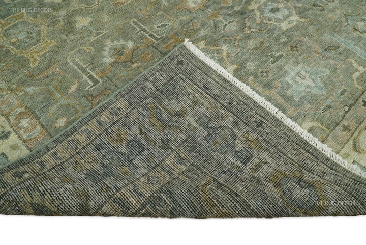 Rug corner with woven trim and dense pattern in gray-green with muted beige accents