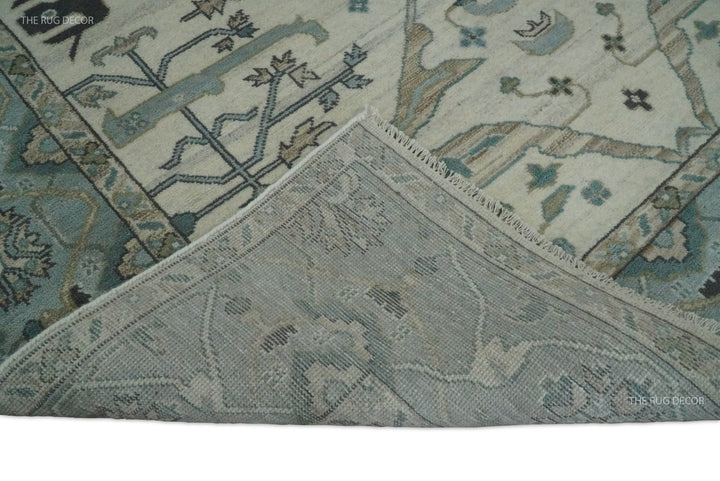 Turned-up rug corner shows the woven backing and patterned wool face