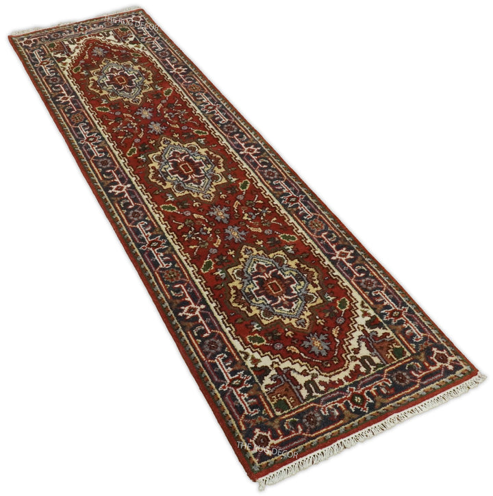 Sera Runner rug shown diagonally, with repeating medallions and fringed end