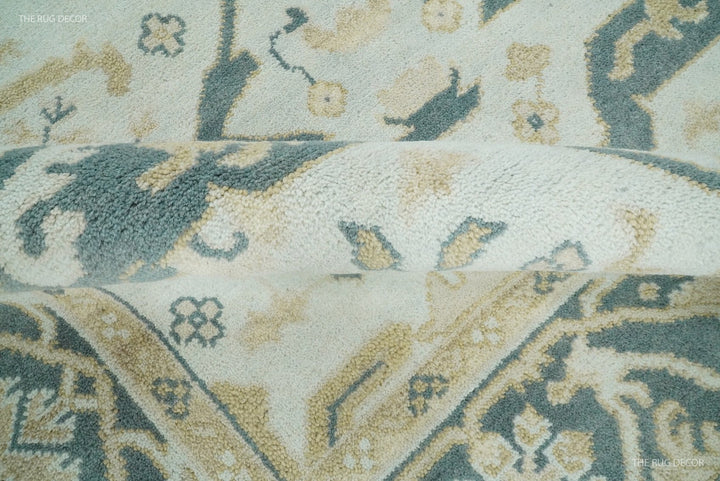 Teal and ivory Oushak wool rug close-up showing textured plush pile