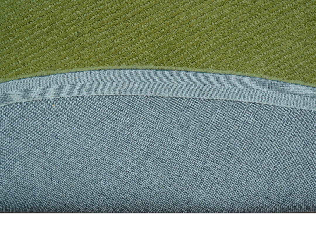Green wool rug backing with a curved bound edge