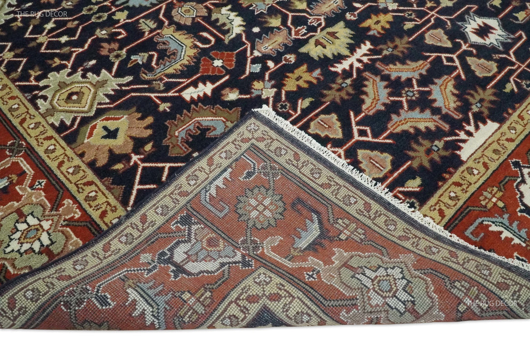 Folded rug corner reveals the woven backing and patterned front