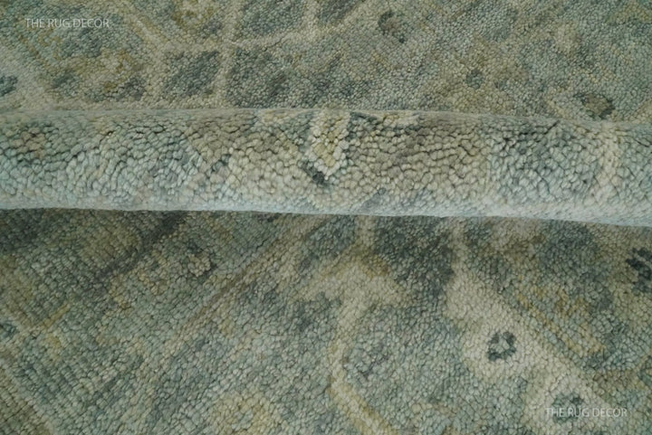Folded rug edge revealing the dense wool pile and patterned surface