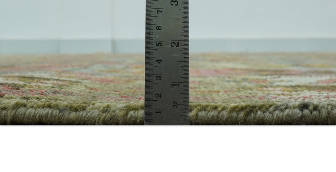 Hand-knotted wool rug with ruler measuring along the border and pile height