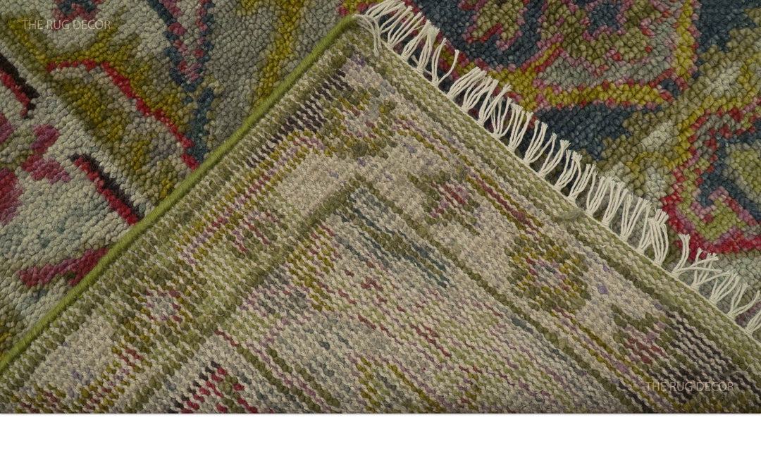 Runner rug folded back to show its woven underside and fringed edge