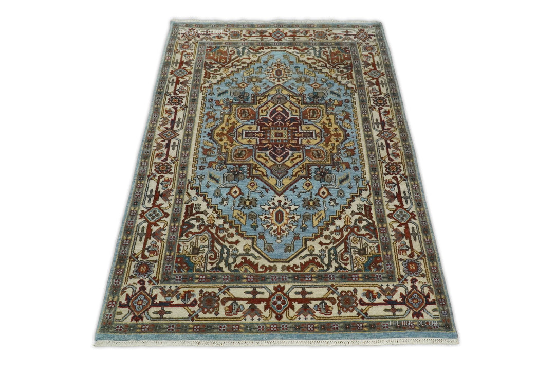 Sera blue and ivory rug with a central medallion and intricate floral border
